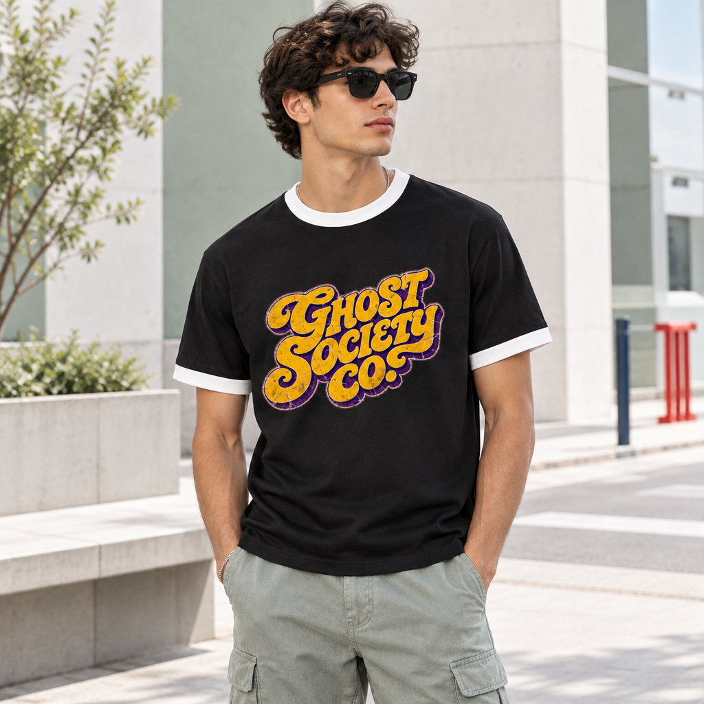 Model wearing black GHOST SOCIETY CO. ringer T-shirt with contrasting white trim in an urban setting